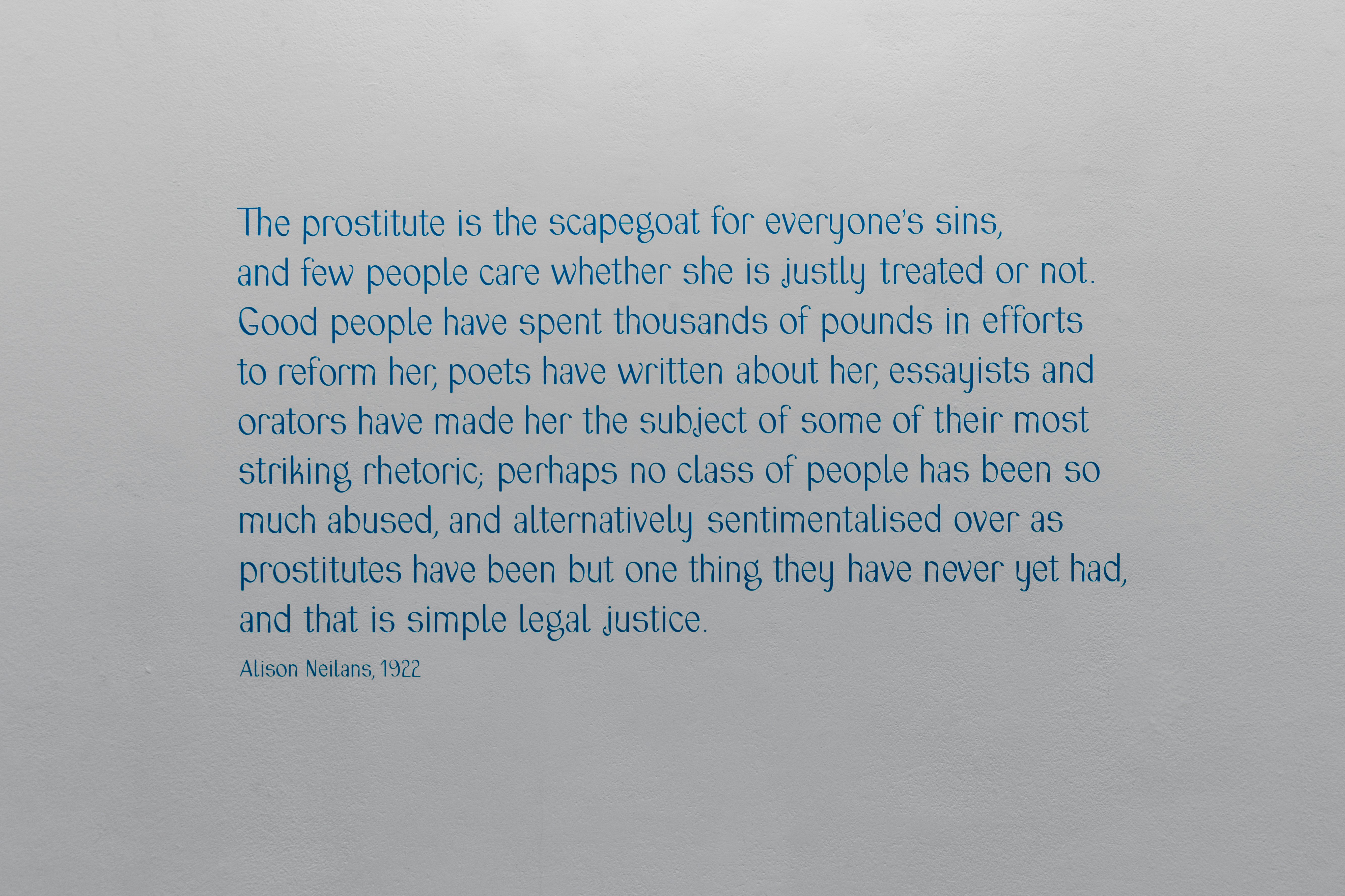 A wall with the text printed on it which reads: 